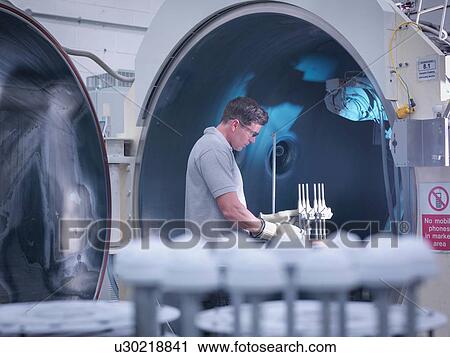 Engineer with ceramic coating machine, coating artificial hip joints in orthopaedic factory View Large Photo Image Stock Image - Engineer with ceramic coating machine, coating artificial hip joints in orthopaedic factory. Fotosearch