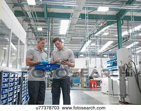 Engineers discussing work in orthopaedic factory View Large Photo Image Stock Image - Engineers discussing work in orthopaedic factory. Fotosearch