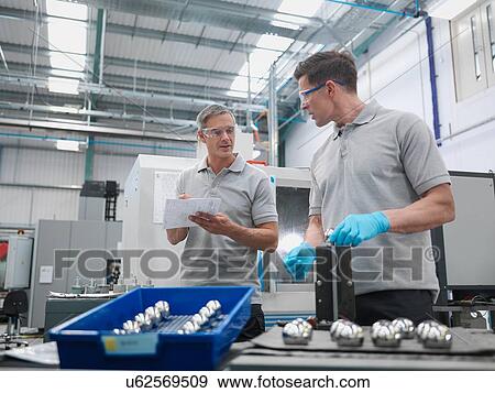 Engineers finishing artificial hip joints in orthopaedic factory View Large Photo Image Stock Photo - Engineers finishing artificial hip joints in orthopaedic factory. Fotosearch