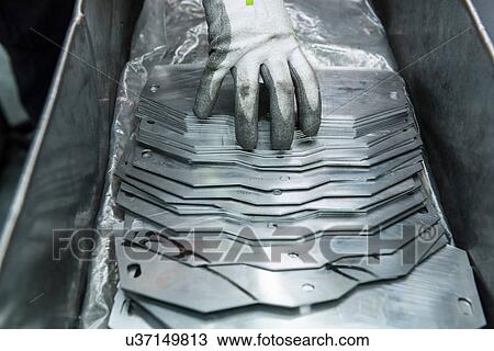 Engineers hand arranging cut parts in engineering factory, close up View Large Photo Image Stock Image - Engineers hand arranging cut parts in engineering factory, close up. Fotosearch