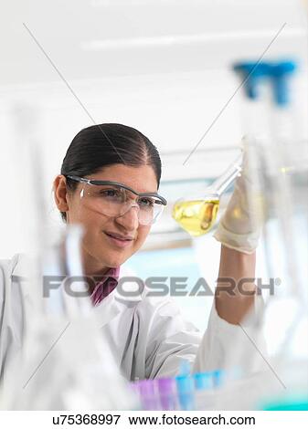 Female scientist developing chemical formula in laboratory View Large Photo Image Stock Photo - Female scientist developing chemical formula in laboratory. Fotosearch