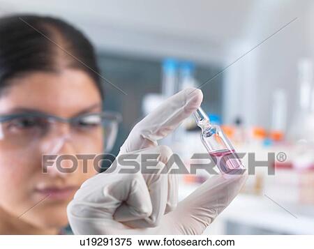 Female scientist testing medical drug ampule in laboratory View Large Photo Image Stock Photography - Female scientist testing medical drug ampule in laboratory. Fotosearch