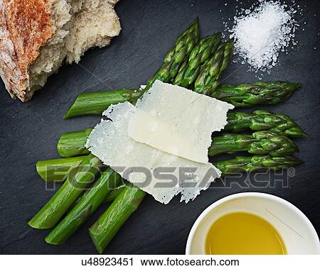 Fresh asparagus with hard cheese, overhead view View Large Photo Image Stock Image - Fresh asparagus with hard cheese, overhead view. Fotosearch
