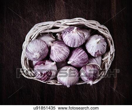 Stock Photography - Garlic in basket, overhead view. Fotosearch