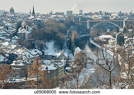 High angle view of city and river Aare with snow covered rooftops, Berne, Switzerland View Large Photo Image Stock Photography - High angle view of city and river Aare with snow covered rooftops, Berne, Switzerland. Fotosearch