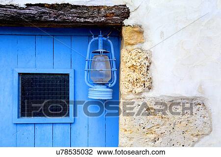 Stock Image - Lantern outside building, Mornac-sur-Seudre, Poitou-Charentes, France. Fotosearch