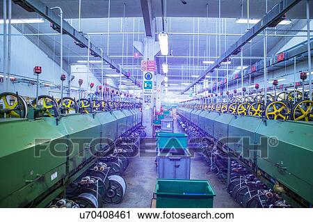 Stock Image - Machinery for rope production in factory that produces products for boating and camping. Fotosearch