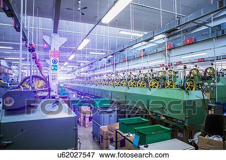 Stock Photo - Machinery for rope production in factory that produces products for boating and camping. Fotosearch