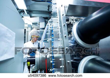 Male scientist writing notes in lab cleanroom View Large Photo Image Stock Photograph - Male scientist writing notes in lab cleanroom. Fotosearch