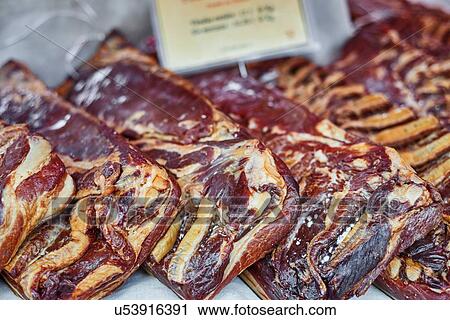 Stock Image - Meat on a market stall, close-up. Fotosearch