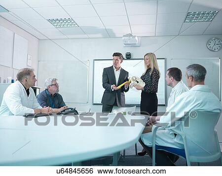 Medical product designers in presentation about orthopaedic product designs View Large Photo Image Stock Photograph - Medical product designers in presentation about orthopaedic product designs. Fotosearch