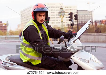 Motor scooter rider in London, undertaking taxi driver training the knowledge View Large Photo Image Picture - Motor scooter rider in London, undertaking taxi driver training the knowledge. Fotosearch