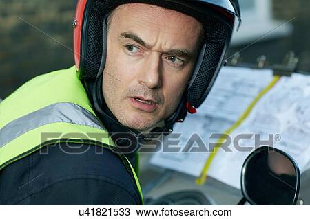 Motor scooter rider, undertaking taxi driver training the knowledge, looking over the shoulder View Large Photo Image Stock Image - Motor scooter rider, undertaking taxi driver training the knowledge, looking over the shoulder. Fotosearch