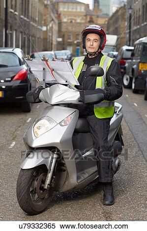 Motor scooter rider, undertaking taxi driver training the knowledge, on London street View Large Photo Image Stock Photography - Motor scooter rider, undertaking taxi driver training the knowledge, on London street. Fotosearch