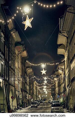 Stock Image - Night time view of christmas star lights in street, Lausanne, Switzerland. Fotosearch