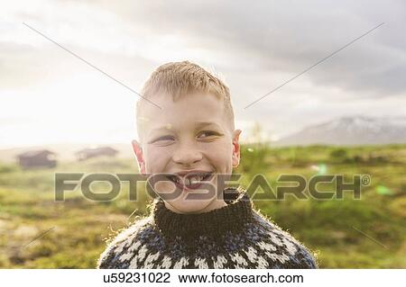 Portrait of boy wearing knit sweater, Thingvellir, Iceland View Large Photo Image Stock Image - Portrait of boy wearing knit sweater, Thingvellir, Iceland. Fotosearch