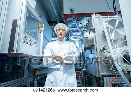 Portrait of male scientist with arms folded in lab cleanroom View Large Photo Image Stock Photography - Portrait of male scientist with arms folded in lab cleanroom. Fotosearch