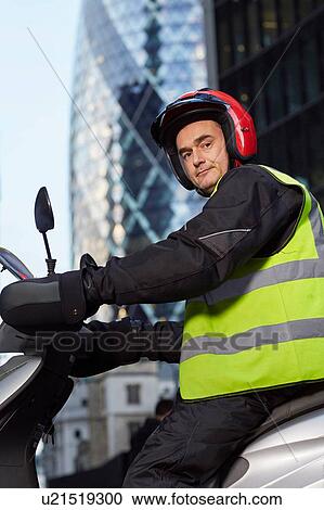 Portrait of motor scooter rider in front of the Gherkin, London, UK View Large Photo Image Stock Image - Portrait of motor scooter rider in front of the Gherkin, London, UK. Fotosearch