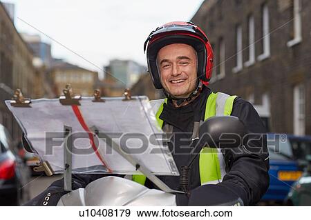 Stock Photo - Portrait of motor scooter rider, undertaking taxi driver training the knowledge. Fotosearch