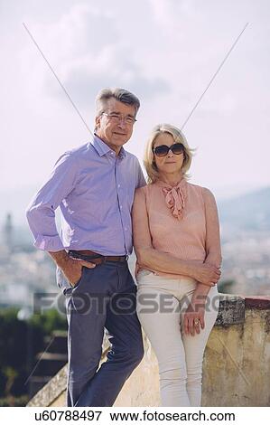 Portrait of senior couple standing together, outdoors View Large Photo Image Stock Photo - Portrait of senior couple standing together, outdoors. Fotosearch