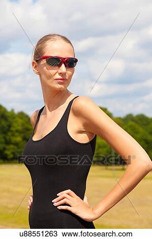 Stock Image - Portrait of woman in countryside. Fotosearch