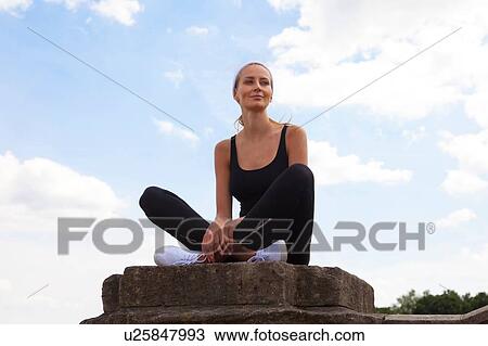 Portrait of woman sitting on pedestal View Large Photo Image Stock Image - Portrait of woman sitting on pedestal. Fotosearch