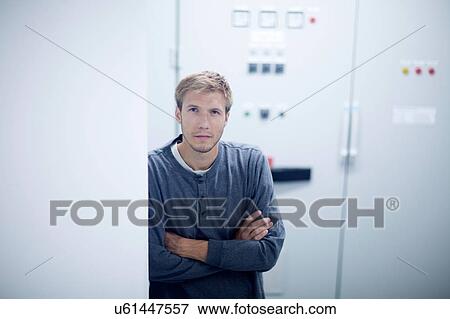 Stock Photo - Portrait of young male technician in technical room. Fotosearch