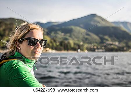 Stock Photo - Portrait of young woman, Lake Como, Italy. Fotosearch