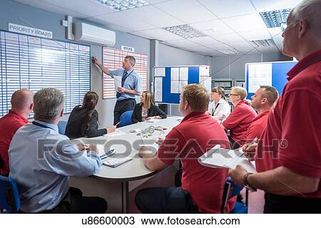 Stock Image - Production meeting in engineering factory. Fotosearch