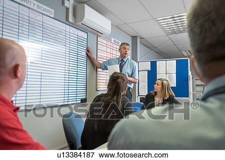 Stock Photo - Production meeting in engineering factory. Fotosearch