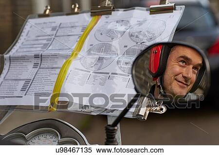 Reflection of motor scooter rider, undertaking taxi driver training the knowledge in wing mirror View Large Photo Image Stock Photography - Reflection of motor scooter rider, undertaking taxi driver training the knowledge in wing mirror. Fotosearch
