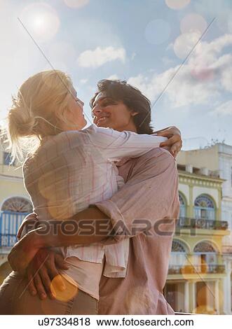 Romantic young couple on restaurant balcony in Plaza Vieja, Havana, Cuba View Large Photo Image Stock Photo - Romantic young couple on restaurant balcony in Plaza Vieja, Havana, Cuba. Fotosearch