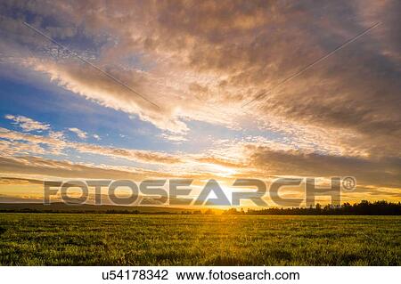 Stock Image - Rural scene, at sunset, Sarsy, Sverdlovsk region, Russia. Fotosearch