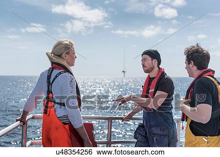 Scientists on deck of research ship View Large Photo Image Stock Photograph - Scientists on deck of research ship. Fotosearch