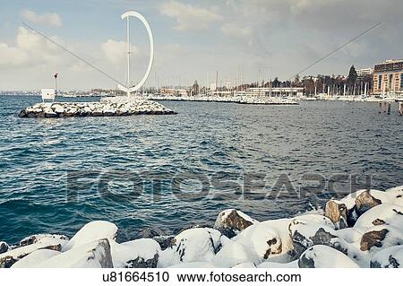Sculpture on snow covered rocks on Lake Geneva waterfront, Lausanne, Switzerland View Large Photo Image Stock Image - Sculpture on snow covered rocks on Lake Geneva waterfront, Lausanne, Switzerland. Fotosearch