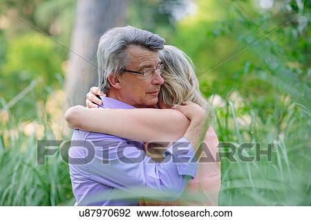 Senior couple, outdoors, embracing View Large Photo Image Stock Image - Senior couple, outdoors, embracing. Fotosearch