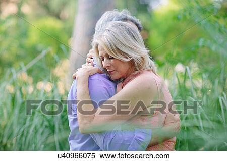 Senior couple, outdoors, embracing View Large Photo Image Stock Photography - Senior couple, outdoors, embracing. Fotosearch