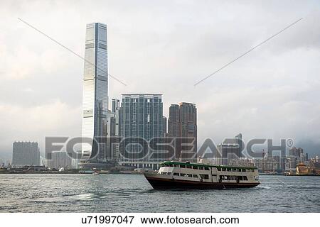 Stock Photo - Skyline, riverboat in foreground, Hong Kong, China. Fotosearch