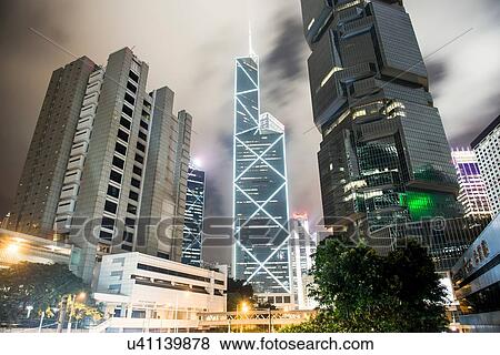 Stock Photo - Skyscrapers at night, low angle view, Hong Kong, China. Fotosearch