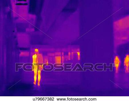 Stock Image - Thermal photograph of commuter in Canary Wharf station, London, UK. Fotosearch