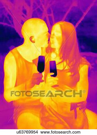 Thermal photograph of romantic young couple drinking wine View Large Photo Image Picture - Thermal photograph of romantic young couple drinking wine. Fotosearch