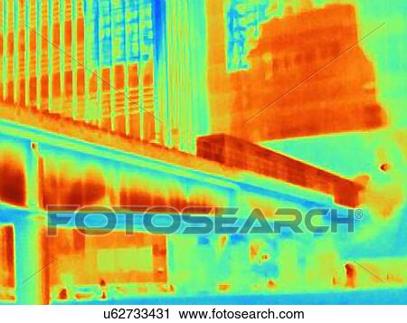 Stock Image - Thermal photograph of train on bridge at Canary Wharf, London, UK. Fotosearch