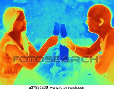 Stock Photograph - Thermal photograph of young couple raising a toast. Fotosearch