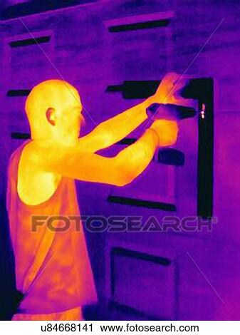 Thermal photograph of young man using a hand drill on cupboard View Large Photo Image Stock Image - Thermal photograph of young man using a hand drill on cupboard. Fotosearch