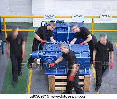 Time lapse of engineers preparing gearboxes for shipping in engineering factory View Large Photo Image Stock Photography - Time lapse of engineers preparing gearboxes for shipping in engineering factory. Fotosearch