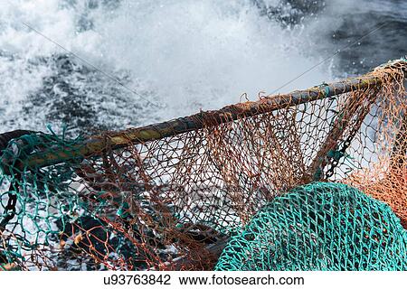 Stock Image - Trawler net on deck of research ship. Fotosearch