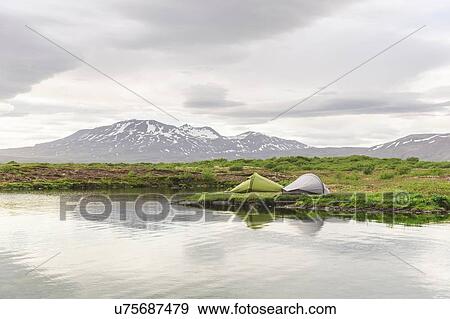 Stock Photo - Two tents camping on lakeside, Thingvellir, Iceland. Fotosearch