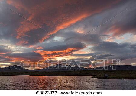 View of lake and mountains at sunset, Thingvellir, Iceland View Large Photo Image Stock Photo - View of lake and mountains at sunset, Thingvellir, Iceland. Fotosearch