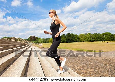 Woman jogging up steps View Large Photo Image Stock Photo - Woman jogging up steps. Fotosearch