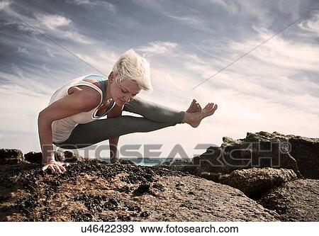 Woman practising yoga by ocean, Cape Town, South Africa View Large Photo Image Stock Image - Woman practising yoga by ocean, Cape Town, South Africa. Fotosearch